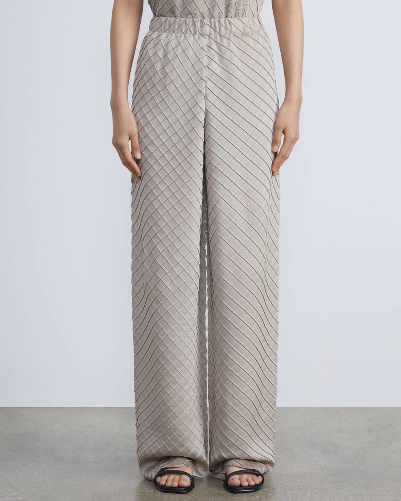 Front of a model wearing a size L Regenerated Poly Satin Diamond Pleat Riverside Pant in Sandstone in Sandstone by Lafayette 148. | dia_product_style_image_id:338659